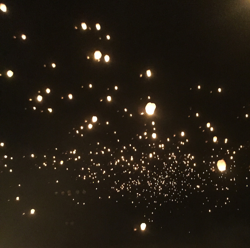 paper lanterns in night sky
